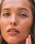 Brown haired model wears Real Depth Multi Purpose Lip And Face Stick
