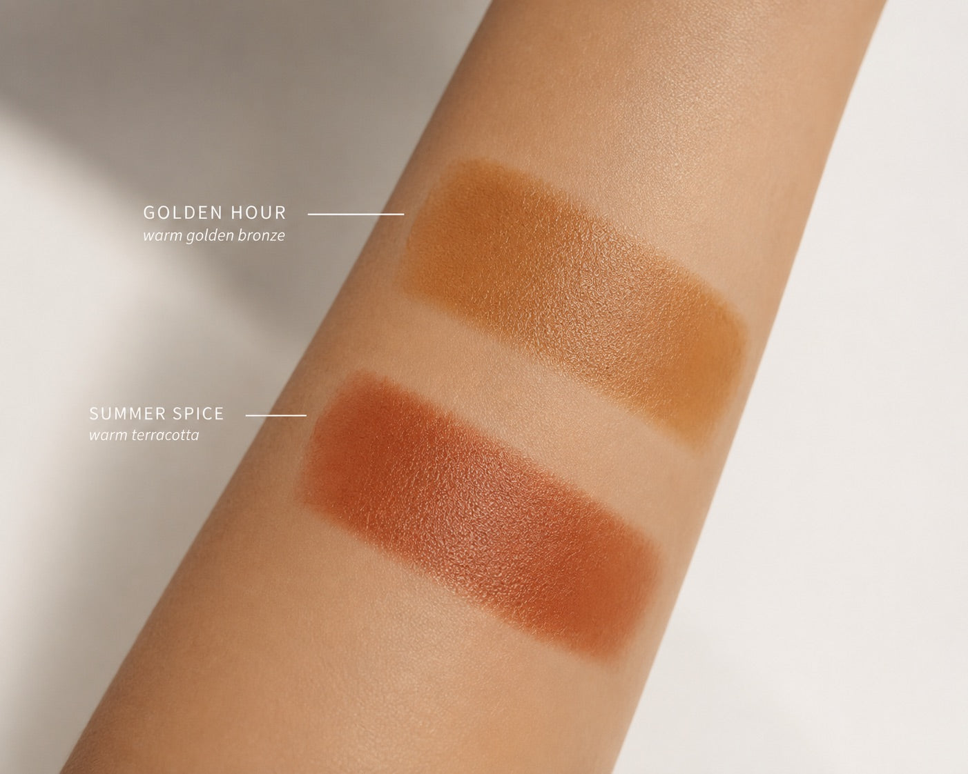 Two makeup swatches on skin labeled 'GOLDEN HOUR' and 'SUMMER SPICE' with text describing the shades as warm golden bronze and warm terracotta.