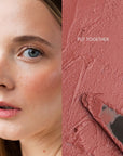 Close-up of a woman's face with a swatch of makeup colour next to it wearing Pearl Beauty Core Four Put Together cream blush stick medium rose colour cream blush vegan cruelty-free