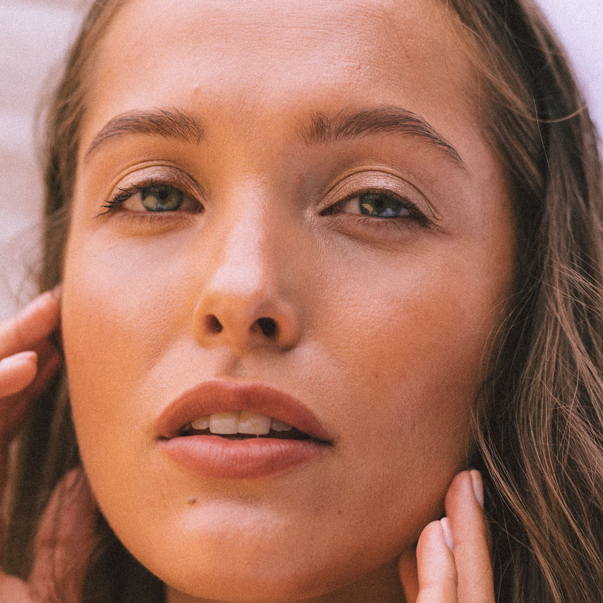 Brown haired model wears Real Depth Multi Purpose Lip And Face Stick