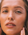 Brown haired model wears Real Depth Multi Purpose Lip And Face Stick